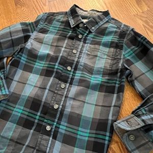 Adorable and unique turquoise, blue, black and gray plaid button down shirt.